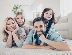 Happy family in living room of their home.